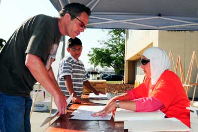 A father looks over the required paperwork